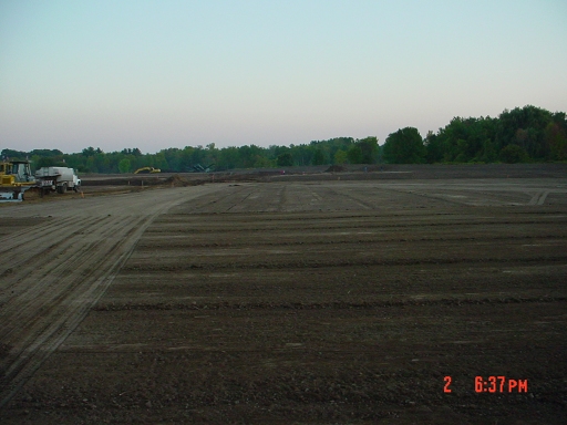 completion of 5" bank-run gravel base for parking lot