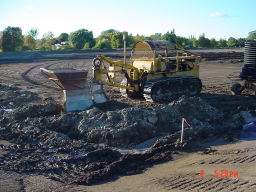 close up of machine that laid drainage tile