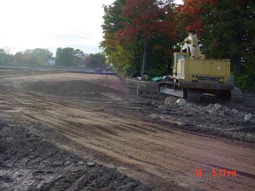 installation of 3" of crusher-run gravel in far side of parking lot
